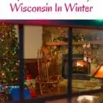 a pin with a living room with fire place and Christmas Tree at one of the most unique places to stay in Wisconsin in Winter.