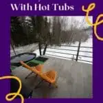 a pin with a deck with 2 seats and a hot tub in snow at one of the best Door County cabins with hot tubs