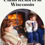 a pin with a family sitting by the fire place at one of the best family cabin resorts in Wisconsin