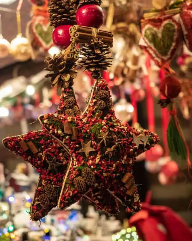 best Christmas fairs in Wisconsin, Close up shot of star-shaped Christmas decorations covered in festive patterns made out of small pieces of colorful confetti