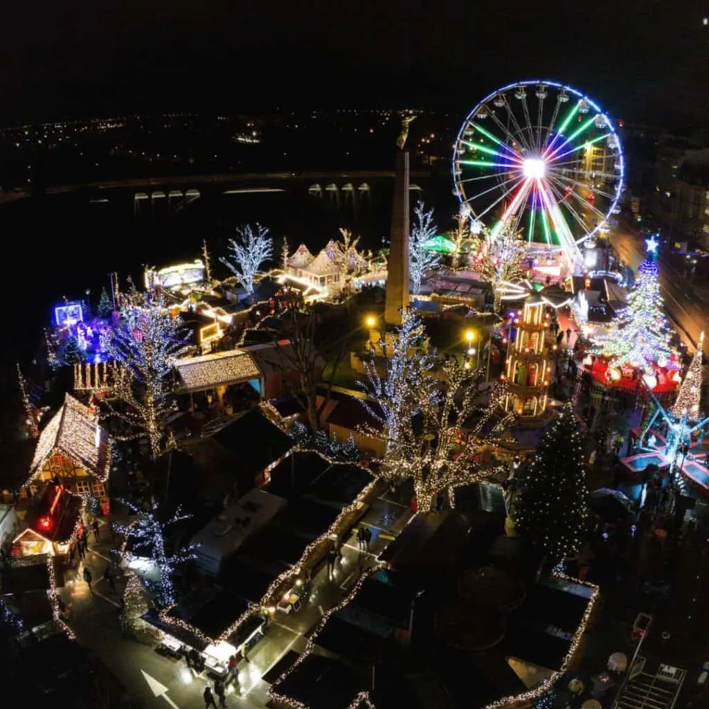 Christmas Market in Luxembourg City drone shot with Christmas lights and  a lighted ferris wheel