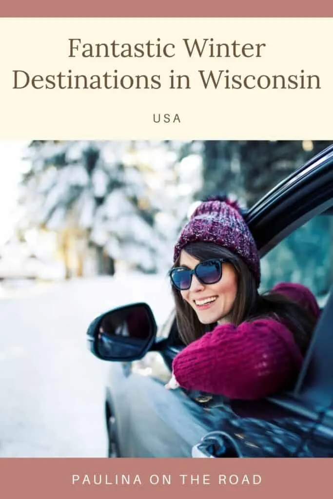 Pin with image of woman in wooled hat and sunglasses smiling while leaning out of the window of a car parked in front of some green trees covered in snow, caption reads: Fantastic Winter Destinations in Wisconsin USA from Paulina on the Road