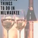 Pin with image of bottle and two filled wine glasses in front of bright lights, caption reads: Fun & Romantic Things to Do in Milwaukee, Wisconsin from paulineontheroad.com