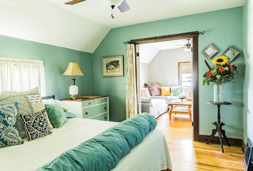 beautifully decorated bedroom with access to the living room at the Your home away from home close to downtown Lake Geneva, Wisconsin