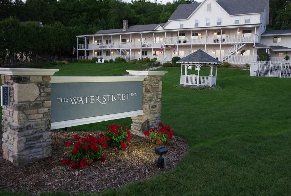 entrance to the Water Street Inn with garden and the hotel in the back in Door County, Wi