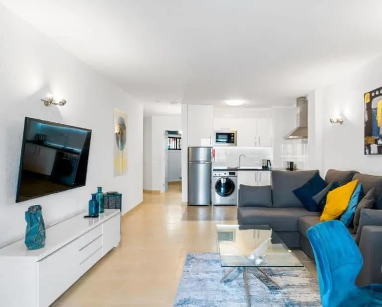 fully equipped apartment with sofa, TV and kitchen at Paloma Beach Apartments in Los Cristianos, Tenerife