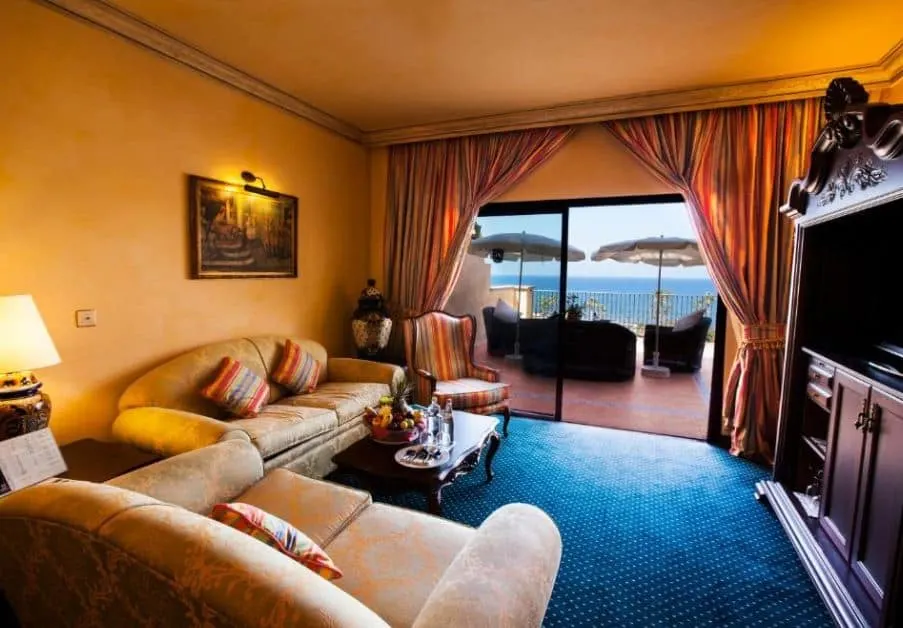 living room in a traditional style with sofa, TV and balcony overlooking the sea at Europe Villa Cortes GL, Tenerife