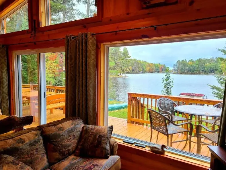 living room with lake view at Bayview Cabin on Northwoods in Elcho, Wisconsin