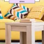 a pin with a coffee table in front of a yellow sofa with Nature Coffee Table Books on it.