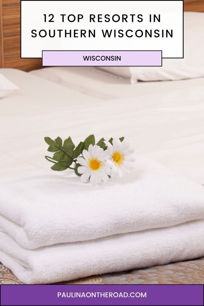 a pin with a flower on a bed at one of the best Resorts In Southern Wisconsin
