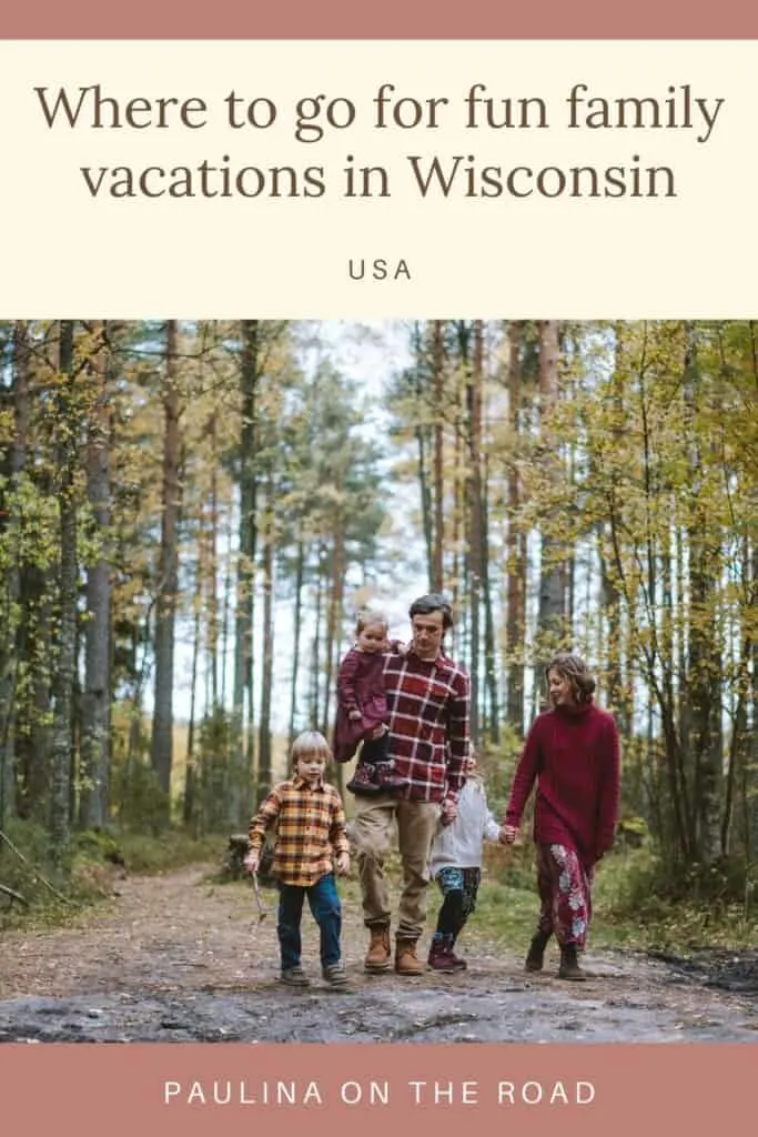Pin with image of family of five in outdoor clothes in fall colors walking through an area of forest with tall green trees surrounding them, caption reads: Where to go for fun family vacations in Wisconsin, USA from Paulina on the Road