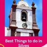 Pin with image of the top of a church bell tower with white stone walls and ornate pillars with a crucifix and statue on top underneath a bright blue sky with some wispy white clouds, caption reads: Best Things to do in Silves from paulinaontheroad.com