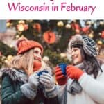 Pin with image of two smiling women in winter coats, hats and gloves holding cups of a warm drink with a brightly decorated Christmas tree behind them, caption reads: USA, Best Things to do in Wisconsin in February from paulinaontheroad.com