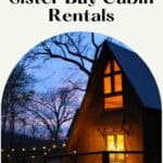 a pin with a cabin at night seen from the outside, one of the best Sister Bay Cabin Rentals