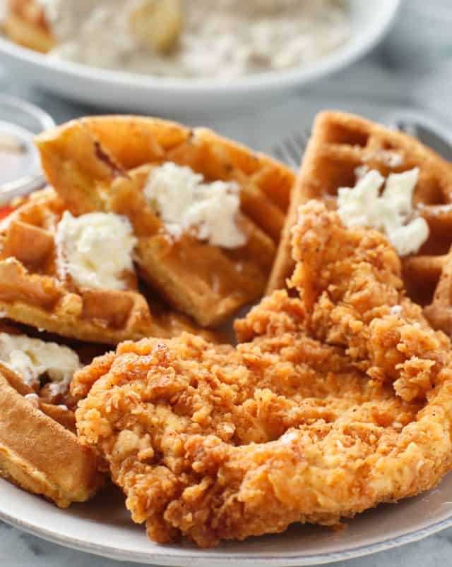 best coffee shops in Milwaukee, Close up shot of a plate full of golden fried chicken and fluffy waffles