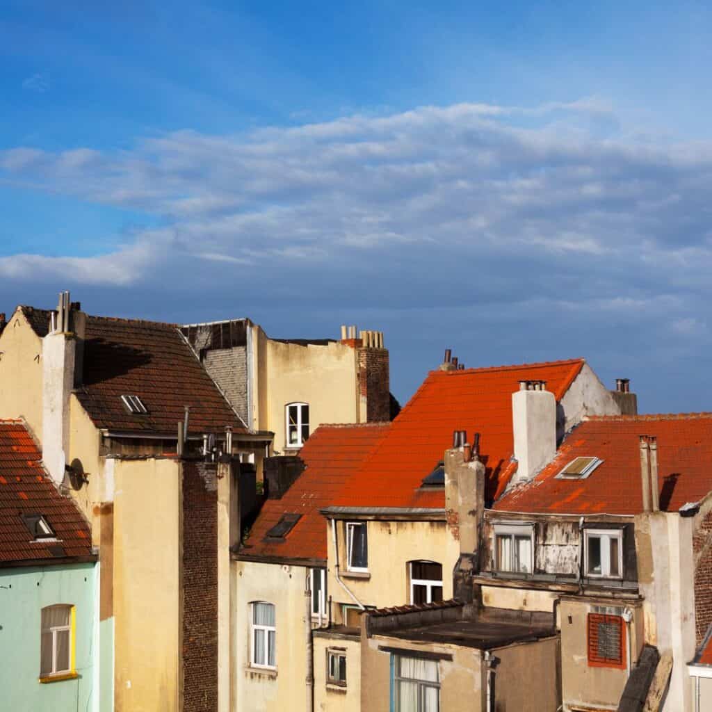 a view of houses on a  cloudy sky