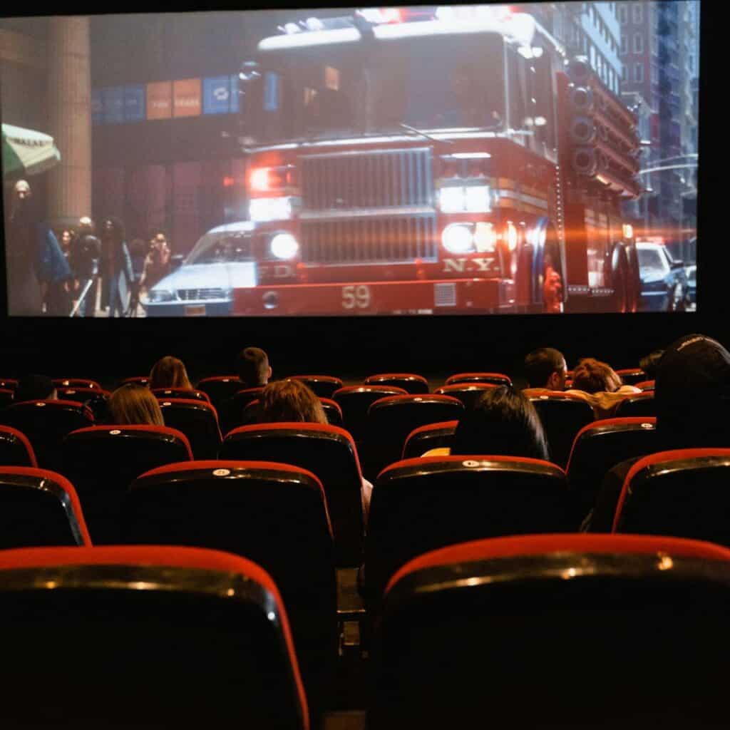people watching a movie inside a cinema