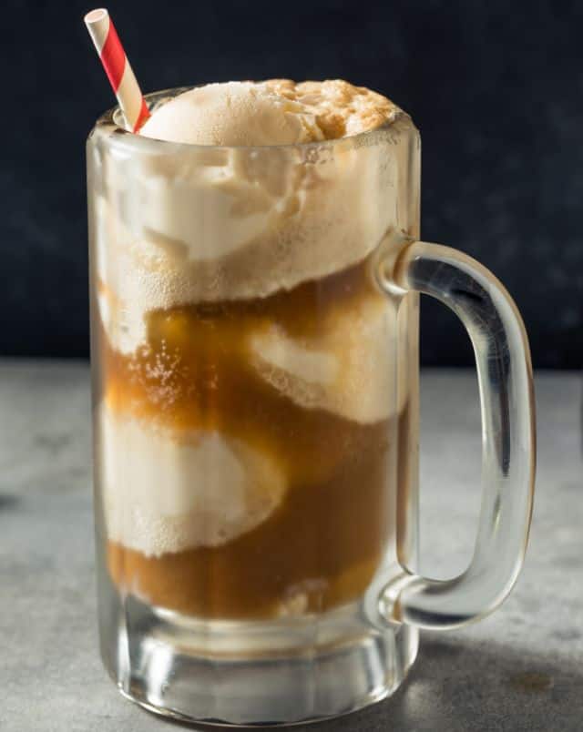 downtown Milwaukee coffee shops, Close up shot of a glass pitcher of root beer with ice cream and a red and white straw