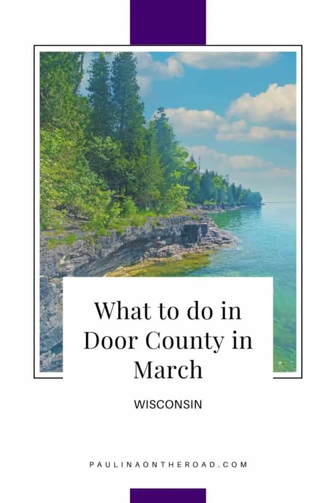 things to do in Door County in March Pin with image of a rocky coastline lined with vibrant green trees atop small cliffs with the clear turquoise waters beneath all under a wide blue sky with white fluffy clouds, caption reads: What to do in Door County in March, Wisconsin from paulinaontheroad.com