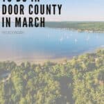 Pin with aerial shot of white sailing boats floating in a harbor between banks covered in thick green forest all under a wide open blue sky with a few wispy white clouds, caption reads: Fun Things to Do in Door County in March, Wisconsin from paulinaontheroad.com