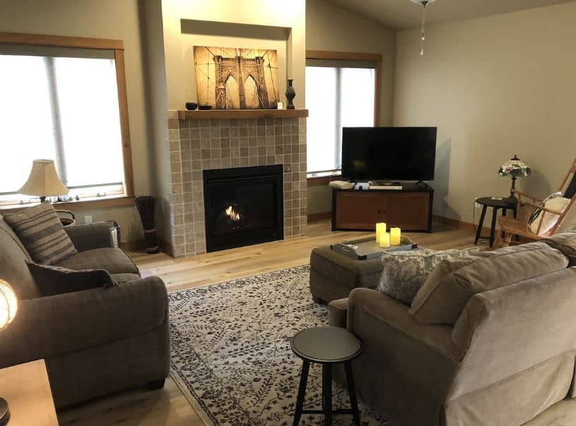 living room with sofas, TV and fire place at The River Bed Condo in Sheboygan, Wisconsin