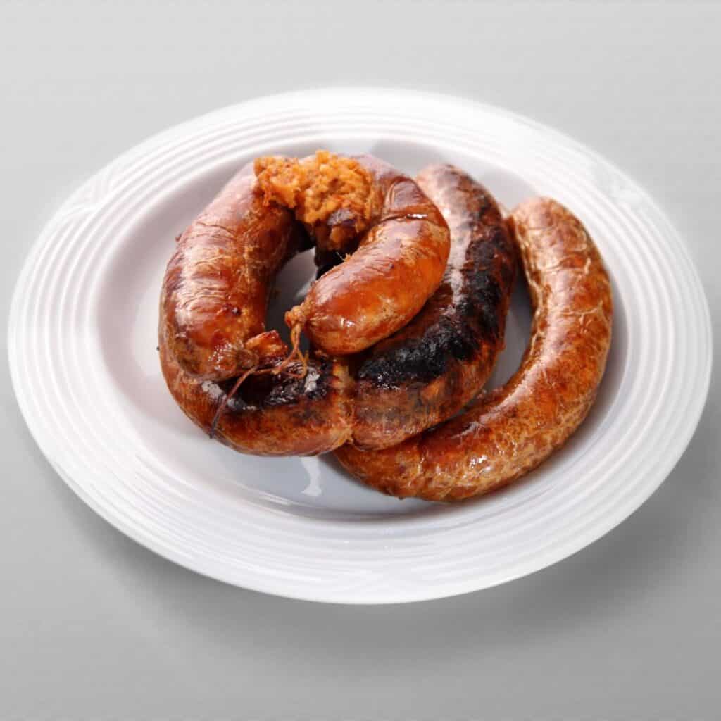 portuguese sausages on a white plate