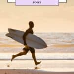 a pin with a man with a surf board on the beach, Surf Photography Books