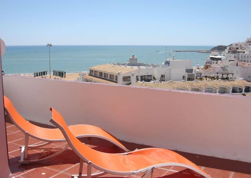 2 sun lounges on the balcony at Amazing apartment with sea view, Albufeira, Portugal