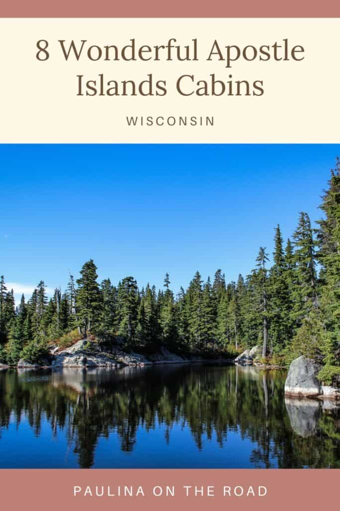 a pin with a lake surrounded by forest where you can find some of the best Apostle Islands cabins