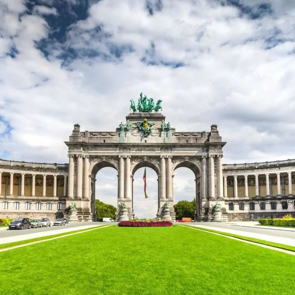 triple arch monument in brussels belgium looking from grass area