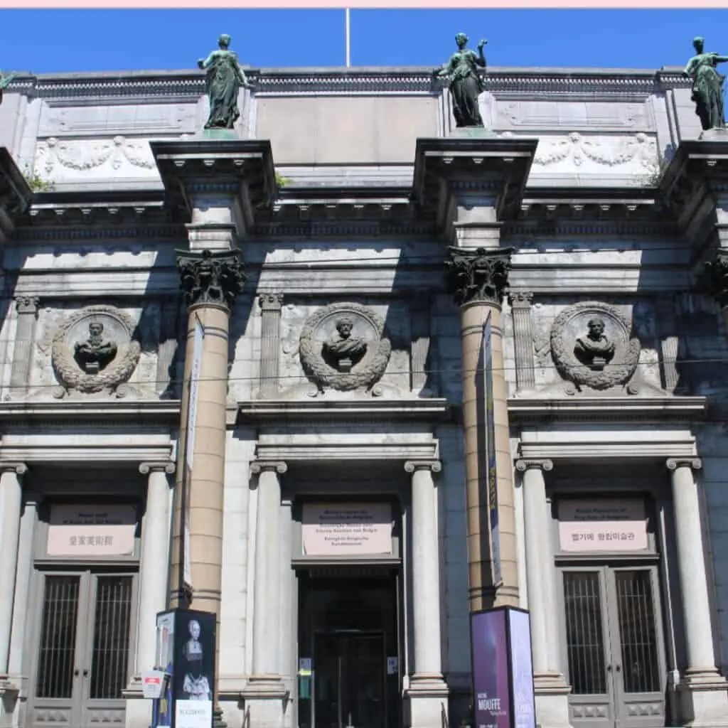 a facade of a Royal Museums of Fine Arts of Belgium with stone carvings and statues