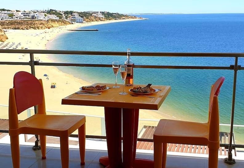 stunning view of the sea and beach seen from the balcony of the one of the best accommodation in Albufeira