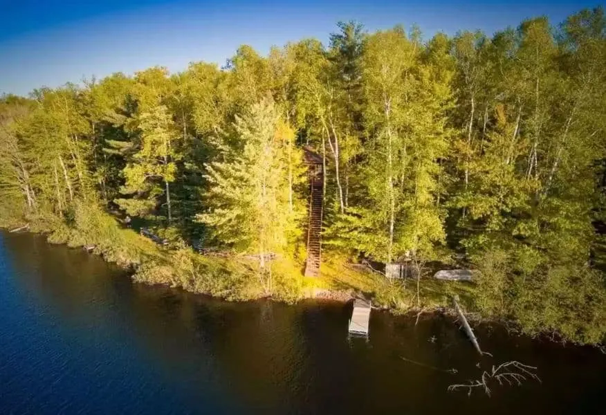 the Quiet Cabin on Bearskull Lake in Park Falls, Wisconsin seen from the lake with dock directly to the lake