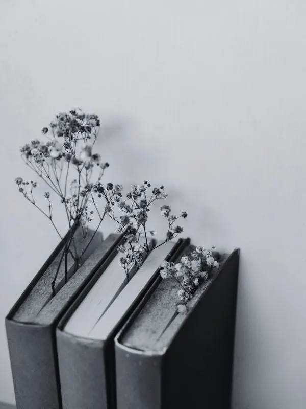 3 Black-And-White Coffee Table Books with flowers inside