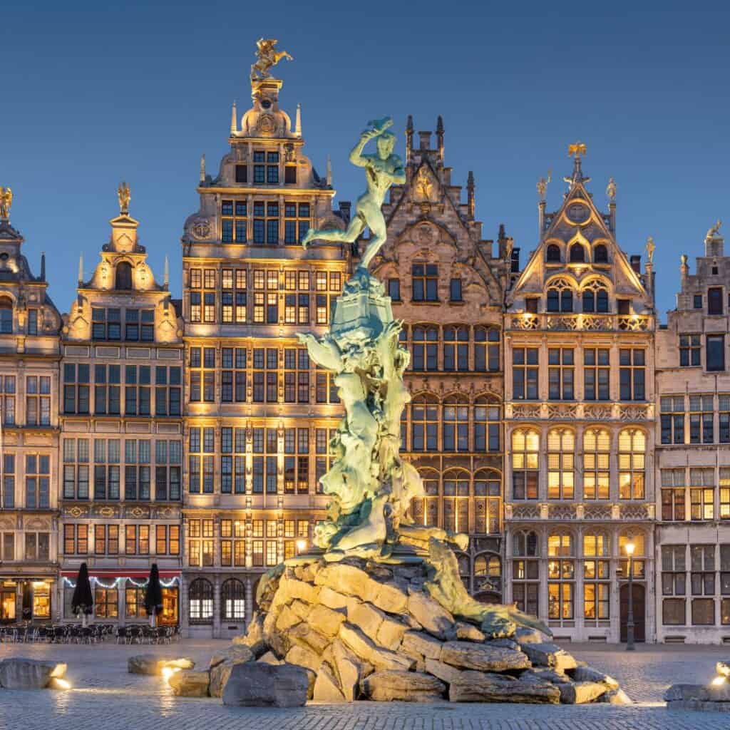 the statue stands in front of a building in antwerp, belgium