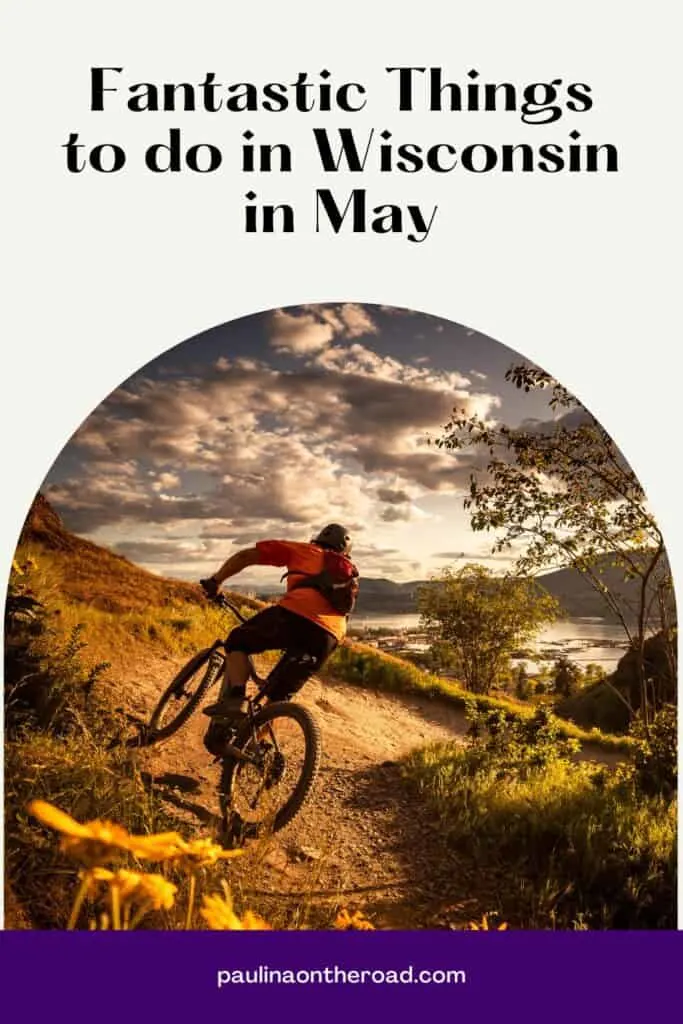 Pin with image of a woman in cycling gear riding an off-road bicycle along a trail through rough fields of golden grass with small green trees to one side all under a dramatic cloudy sky at sunset, caption reads: Fantastic Things to do in Wisconsin in May from paulinaontheroad.com