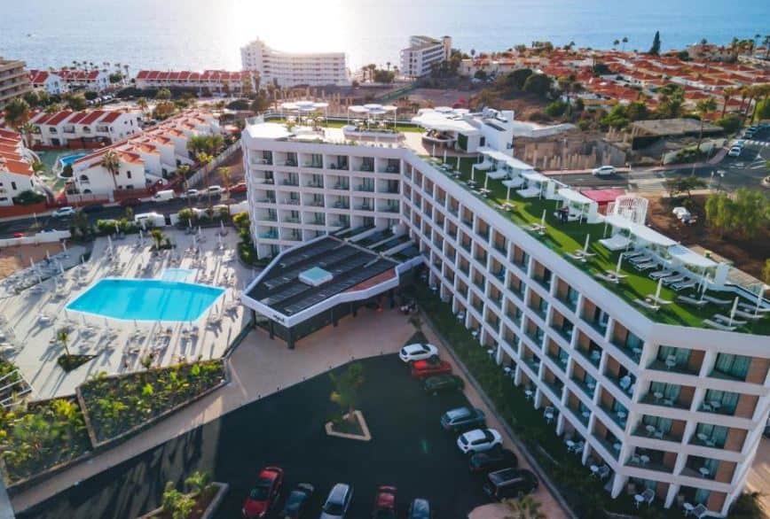 aerial view of the MYND Adeje hotel with pool area and roof top relaxing area in Tenerife