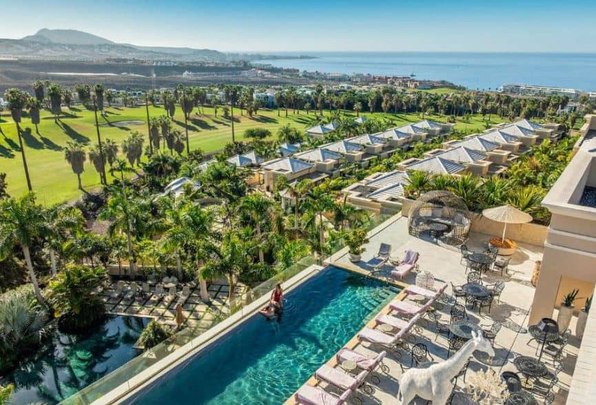 panoramic view of the Royal River, Luxury Hotel in Adeje, Tenerife with pool area and palm trees overlooking the sea and mountains