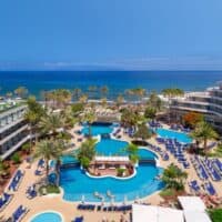view from above of the pool area with sun lounges and sea view at H10 Conquistador, Tenerife, romantic hotels in tenerife