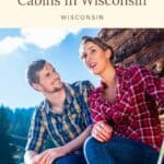 a pin with a couple outside one of the most Romantic Secluded Cabins In Wisconsin