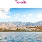 a pin with one of the best Resorts in South Tenerife seen from the sea with a mountain behind.