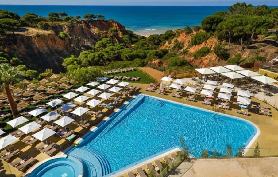 aerial view of the pool area with sun lounges located near the beach with sea view at 3HB Falésia Garden in Albufeira, Algarve, Accommodation In Algarve Accommodation In Algarve