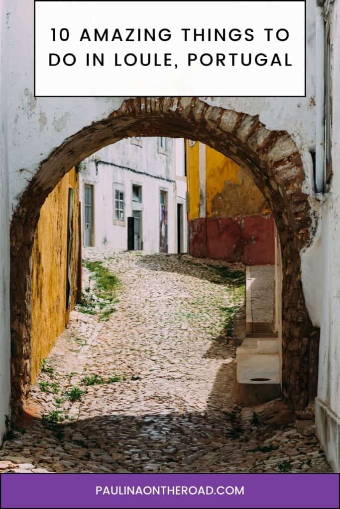 Pinterest pin about amazing things to do in laule portugal, cobblestone street with archway in old town laule