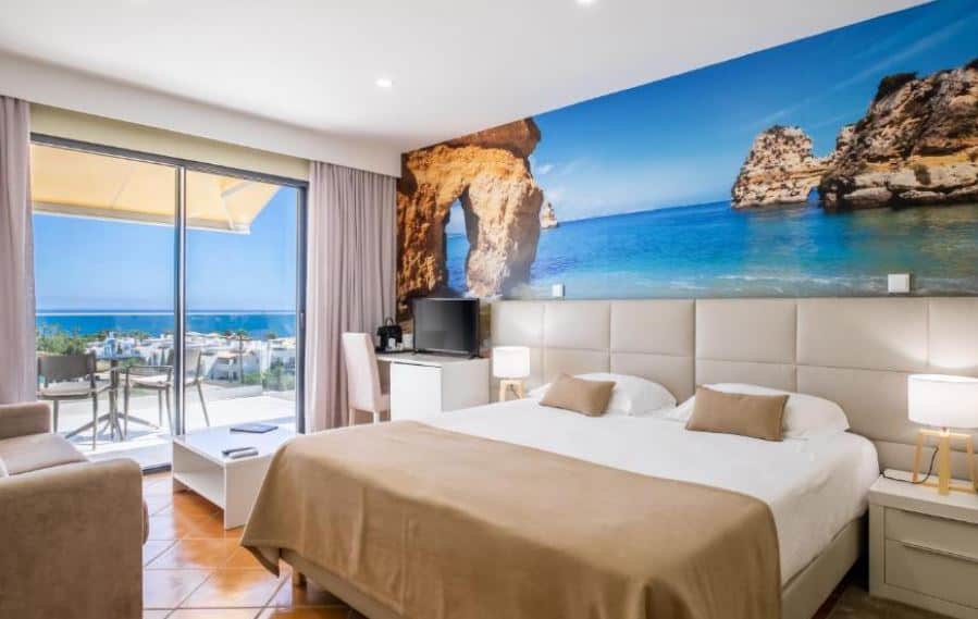 bedroom with balcony overlooking the sea at Lagos Atlantic Hotel in Algarve