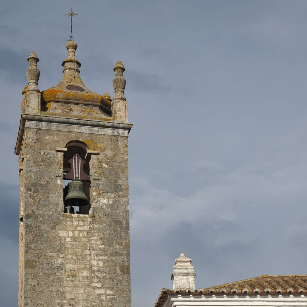 bell tower of sao clemente church in algarve