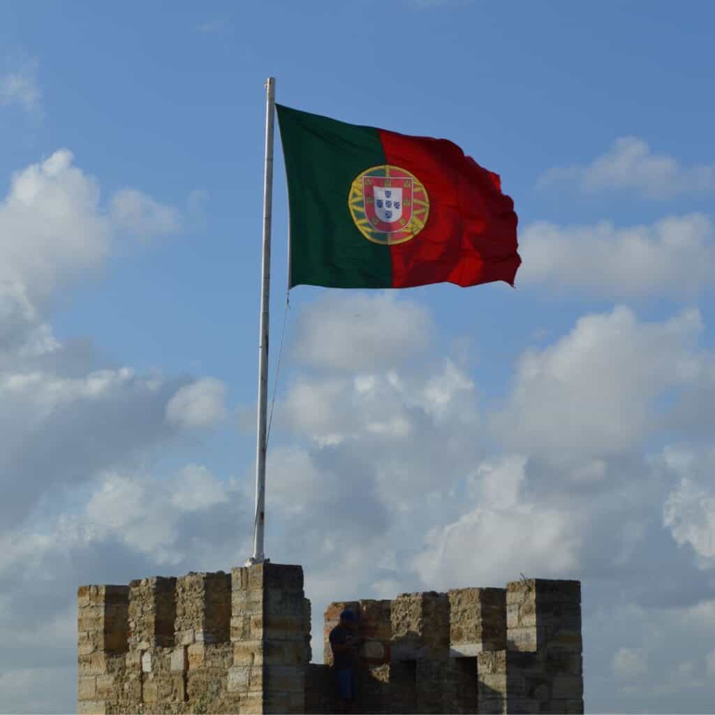 portuguese flag on top of loule castle in algarve