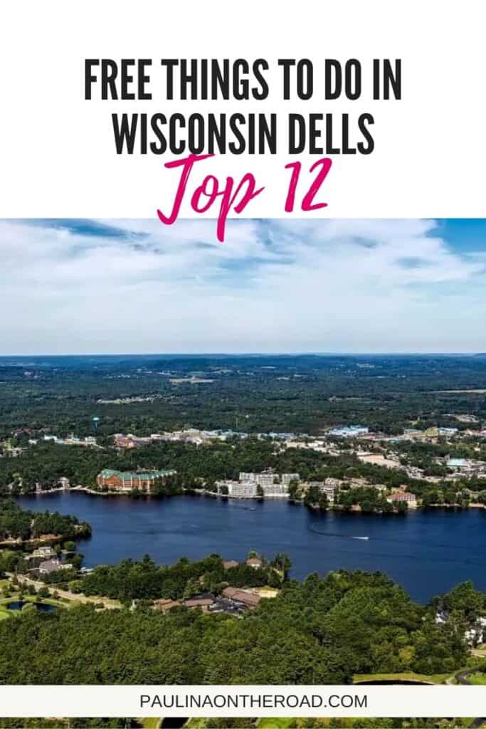 aerial view over wisconsin dells with a lake, trees, and houses