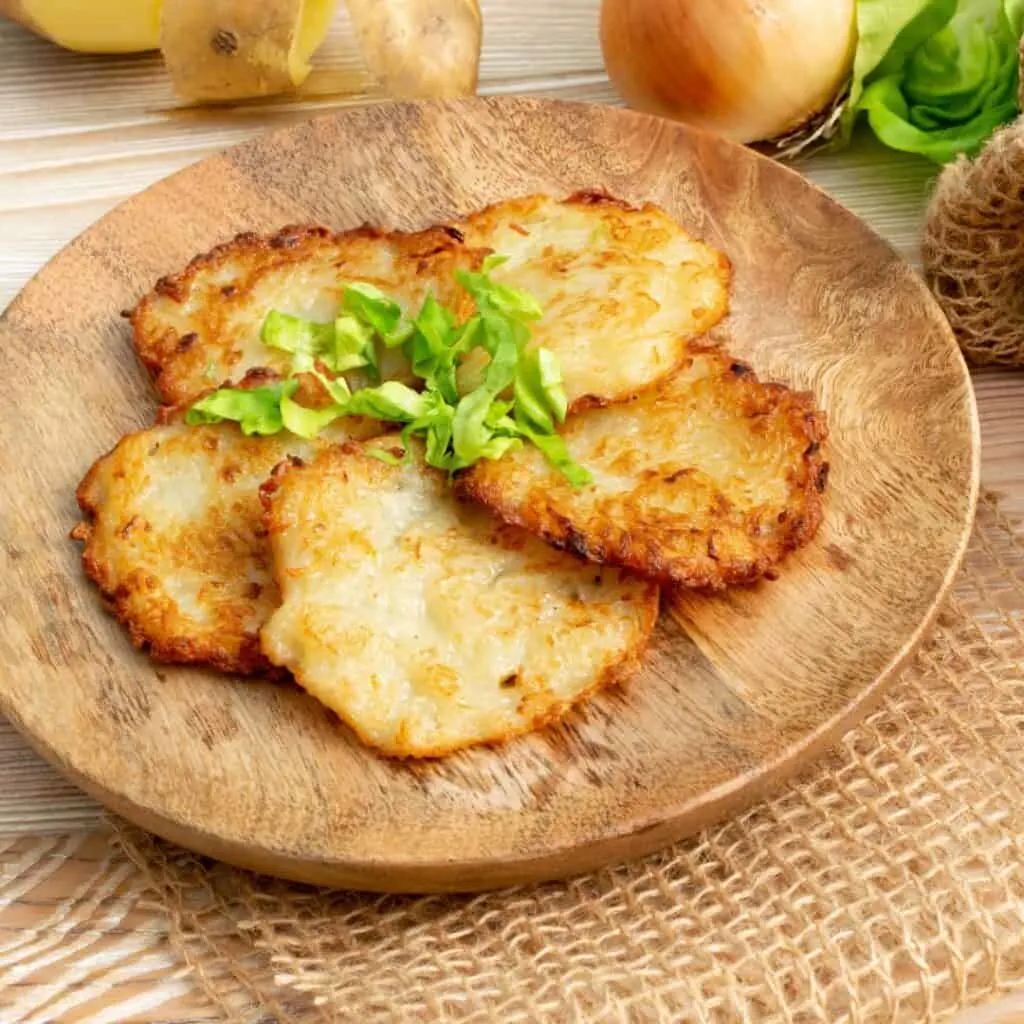 Gromperekichelcher, potato pancakes with rustic background