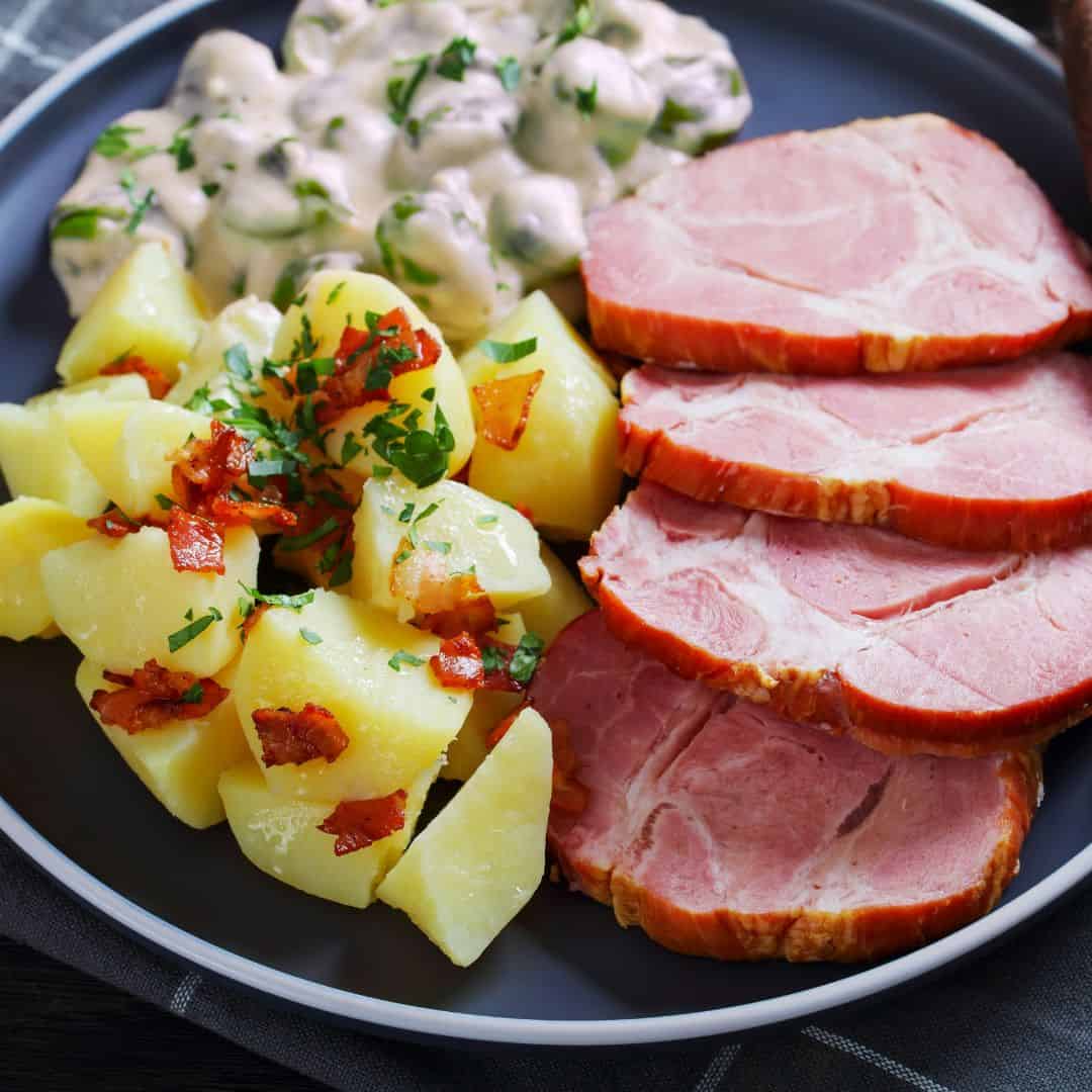 Closeup of Judd mat Gaardebounen, smoked pork collar with beans in creamy sauce and potatoes