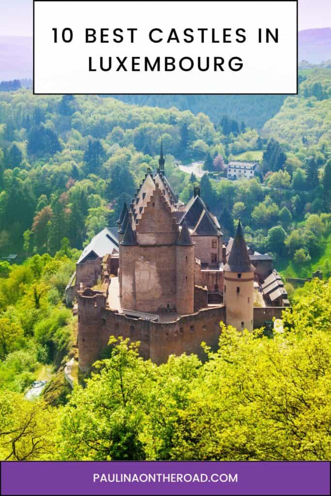 Pinterest pin about best castles in Luxembourg showing aerial photo of vianden castle with bright green foliage during a clear sunny day